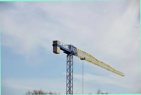 Tower cranes work during the construction of a multi-story building. New ap.. Stock Photos