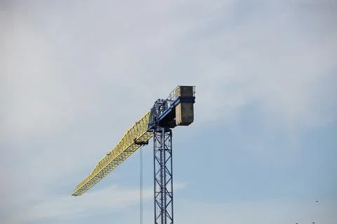 Tower cranes work during the construction of a multi-story building. New ap.. Stock Photos