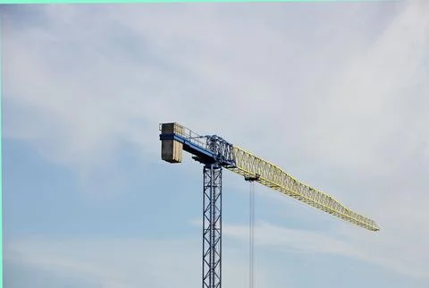 Tower cranes work during the construction of a multi-story building. New ap.. Stock Photos