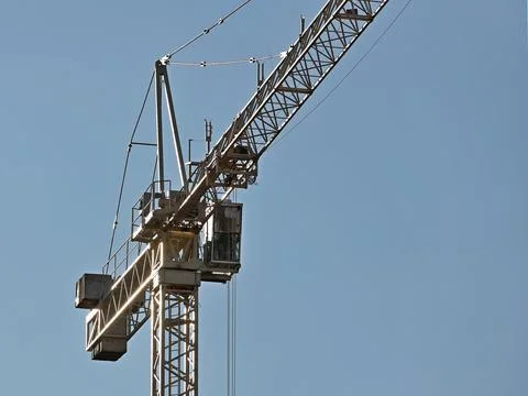 Tower cranes work during the construction of a multi-story building. New ap.. Stock Photos