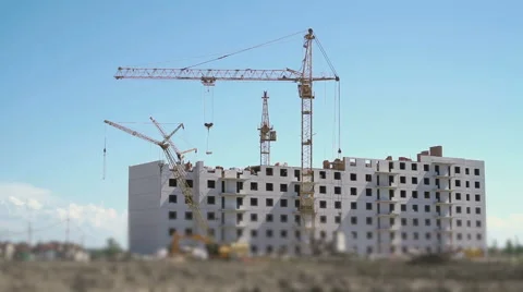 Tower cranes working on the construction site Stock Footage 66063985