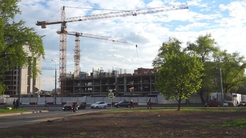 Tower cranes working on a construction site during the day 스톡 동영상 69168330
