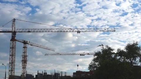 Tower cranes working on construction site during the day Stock Footage 69170840