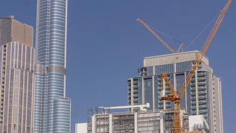 Tower cranes working on the construction site of new skyscraper of the monoli Foto stock