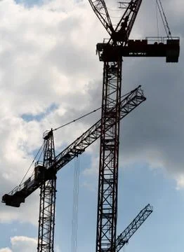 Tower Cranes working at constuction site. Stock Photos