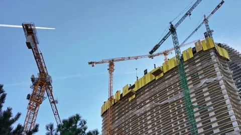 Tower Cranes Working Over Rising Skyscraper Stock-Footage 342268161