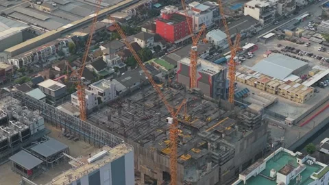 Tower cranes working on a skyscraper construction site in bangkok Stock Footage 327819910