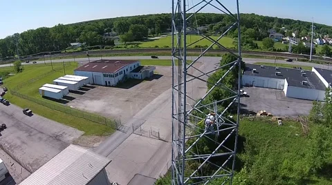 Tower Crew attaching antenna to broadcast tower. Stock Footage 40366467