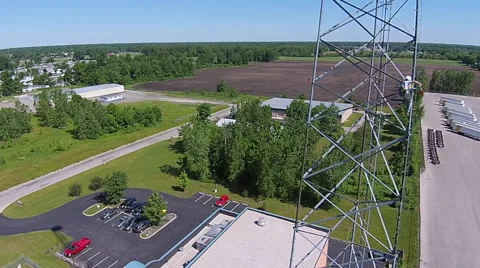 Tower Crew climbing tower changing light bulbs aerial view Stock Footage 49753294