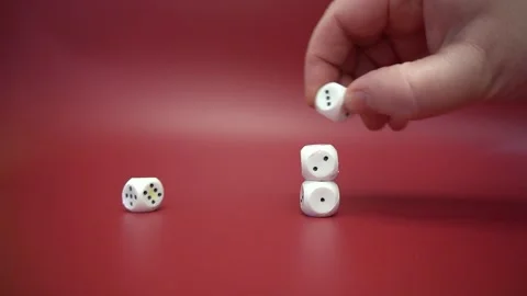 A tower of dice on a red background. Stock Footage 320574084