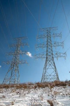 Tower of electrical high voltage power on blue sky Stock Photos
