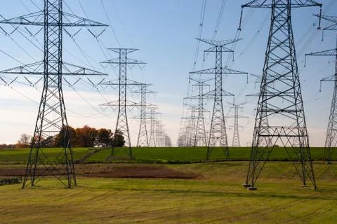 Tower of electrical high voltage power on blue sky Stock Photos