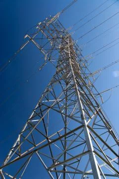 Tower of electrical high voltage power on blue sky Stock Photos