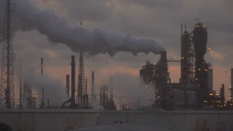 Tower emits large thick grey smoke cloud at refinery factory Stock Footage 115847850