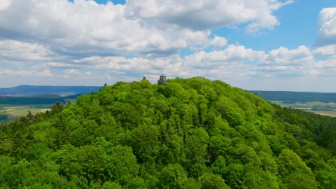 Tower on a forested mountain 動画素材 315745258