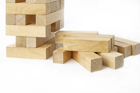 The tower is half-destroyed. Jenga board game with wooden bars. A game of logic Stock Photos