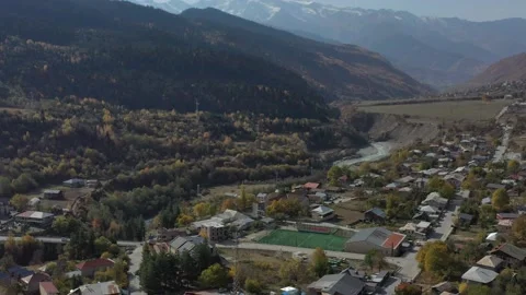 Tower of Lower Chazhash Castle and Ushguli village at the foot of Mt. Shkhara Stock Footage 150565436