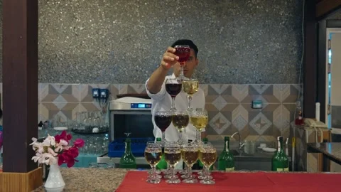 Tower made of glasses with champagne on table. View of delicious alcohol free Video stock 279057120