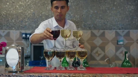 Tower made of glasses with champagne on table. View of delicious alcohol free Stock Footage 279057194
