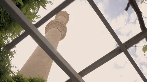 Tower of the mosque through the foliage Stock Footage 90374196