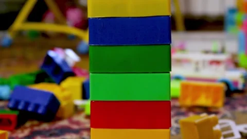 Tower of multi-colored cubes. Mess in the children's room. Scattered across the Stock Footage 240365409