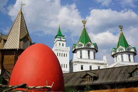 Tower in the old town. Red egg in the foreground Stock Photos