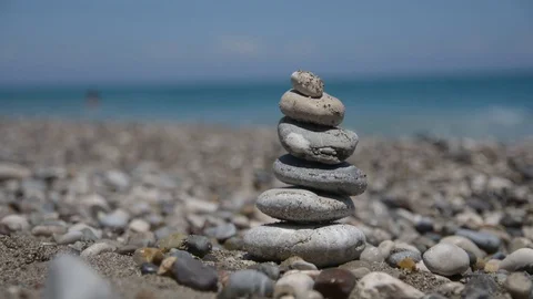 Tower of pebbles on the background of the ocean Stock Footage 111428567