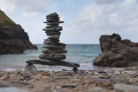 Tower of pebbles on a beach Stock Photos