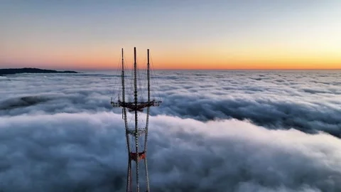 Tower Penetrating the Clouds | Sky-High Tower Stock Footage 304740230