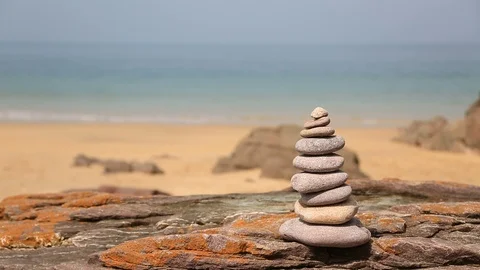 Tower of Rocks on a Beach - Slow Motion Stock Footage 104286785
