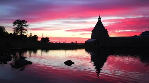 The tower of Russian Orthodox Solovetsky Monastery on amazing red sunset. Stock Footage 64929818