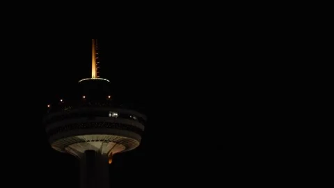 Tower In Sky At Night With Rotating Restaurant Descending Elevator And Flash Video stock 246976272