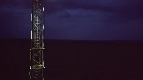 Tower with a spotlight on the background of the night sky Vidéo 137257181