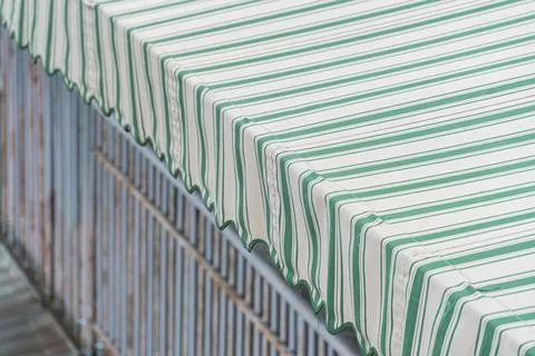 A tower-like stack of colorful cardboard boxes, featuring varying patterns .. Stock Photos