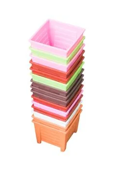 Tower stack of colorful plastic pot for seedling isolated on white background Foto stock