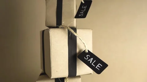 Tower of stacked cardboard gift boxes with sale tags Stock Footage 343718557