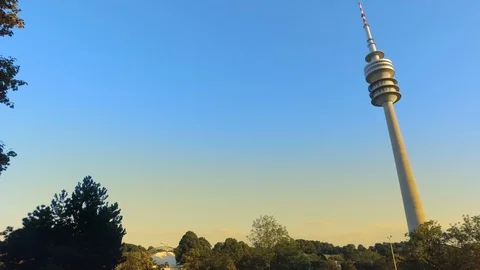 Tower of stadium of the Olympiapark in Munich at sunset, Germany Stock Footage 106597399