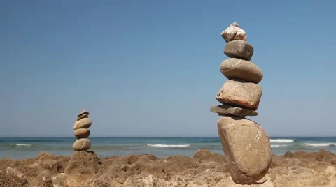 Tower of stones on a background of ocean Stock Footage 65100727