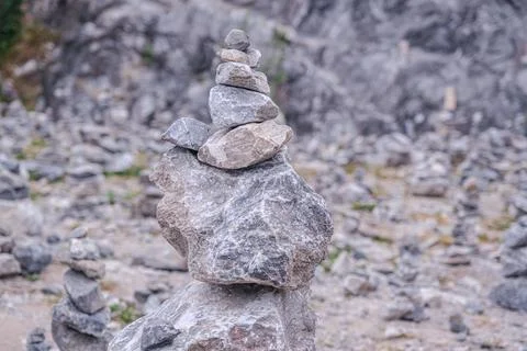 A tower of stones on a blurry background. Stock Photos