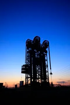 The tower type pumping unit in the evening Stock Photos