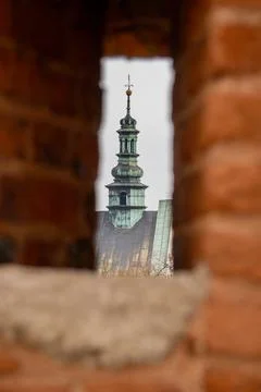 Tower View Through Brick Wall - Architectural Detail. Stock Photos