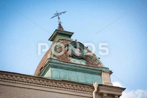 The tower with a weather vane on the roof Stock Photos