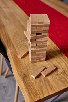 Tower of wood blocks stack game on the table Stock Photos