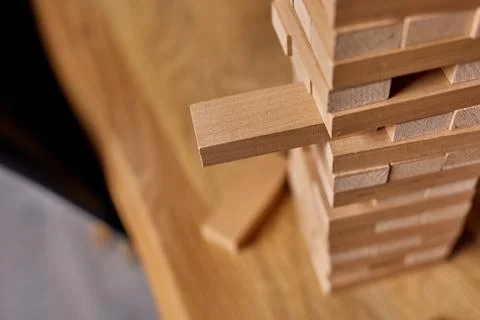 Tower of wood blocks stack game on the table Stock Photos