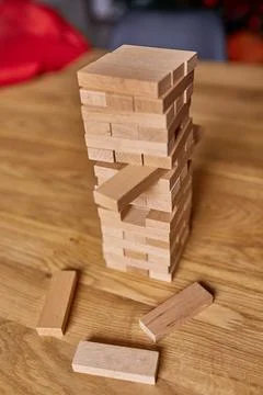Tower of wood blocks stack game on the table Stock Photos