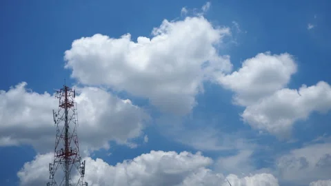 Towering antenna and Dramatic Timelapse of Clear Blue Sky with Fluffy White.. Stock Footage 307514736