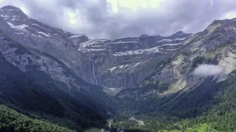 Towering Cliffs and Lush Valley in the Pyrenees Stock Photos