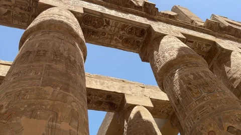 Towering columns of Temple adorned with hieroglyphs, echoing Egypt's rich Stock-Footage 272615026