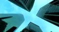 Towering corporate buildings in New York City against blue sky, low angle 4k or 4k+ Resolution