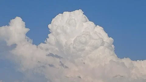 Towering Cumulus Clouds Building Up in Blue Sky 스톡 사진